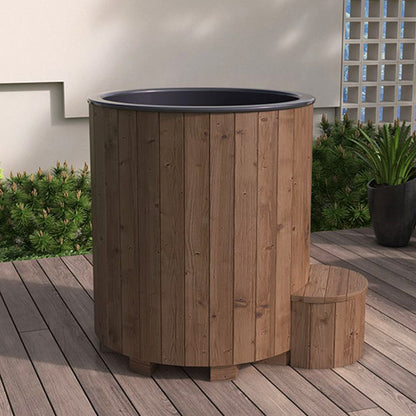 Wooden tub with black interior on a wooden deck