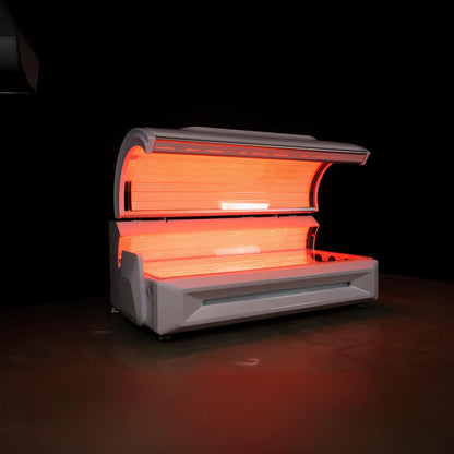 red light bed with glowing interior on a dark background