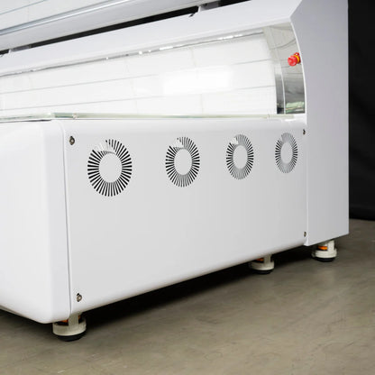 White industrial machine with fans on a gray floor