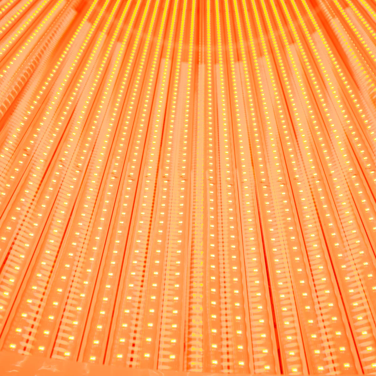 Close-up of orange LED strip lights with a grid pattern
