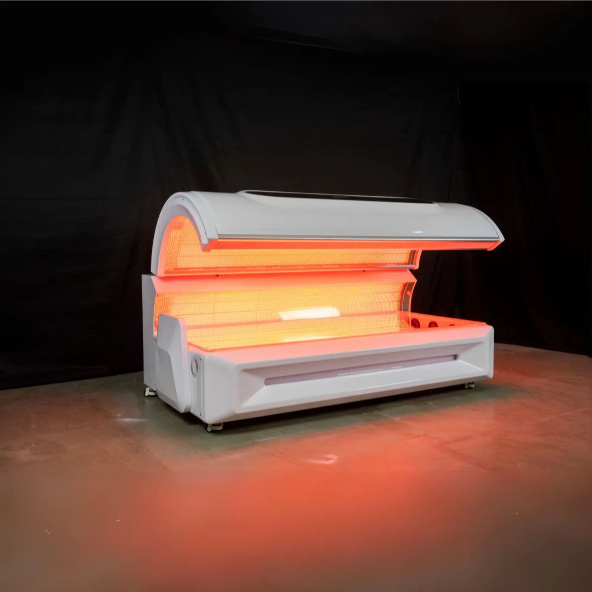 red light bed with glowing orange light on a dark background