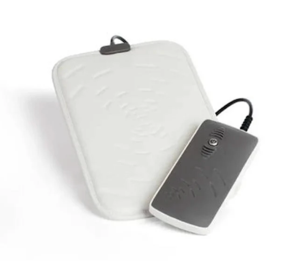 White pemf pad device with a power adapter on a white background