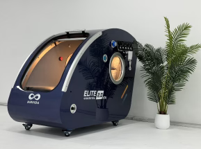  Hyperbaric Chamber labeled 'Elite Pod' on a white floor with a plant in the background