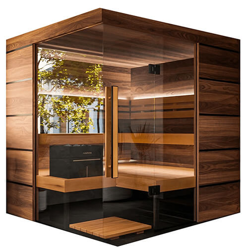 Wooden sauna with glass walls and a black heater inside.