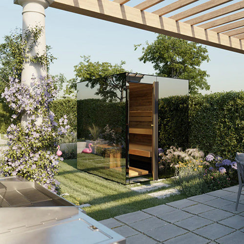 Modern outdoor sauna with glass walls in a garden setting