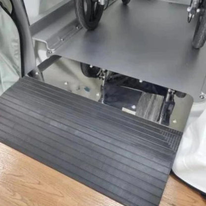 Black wheelchair ramp attached to a Hyperbaric chamber