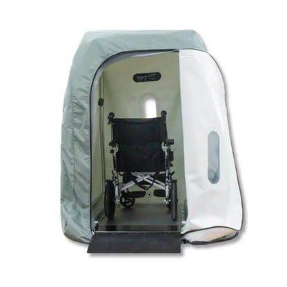 Wheelchair accessible Hyperbaric chamber with a clear cover on a white background