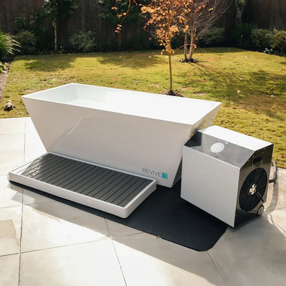 White outdoor bathtub with a small air conditioning unit on a patio