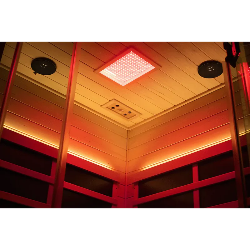 Ceiling with a square light fixture and wooden paneling in a warm-toned room.