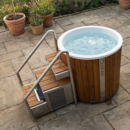 Wooden cold plunge with metal staircase on a white background