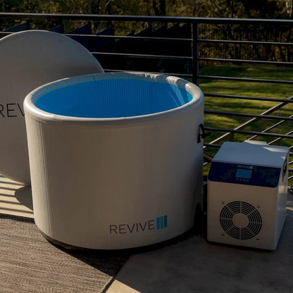 Cold tub with blue interior and 'REVIVE II' branding on a patio.