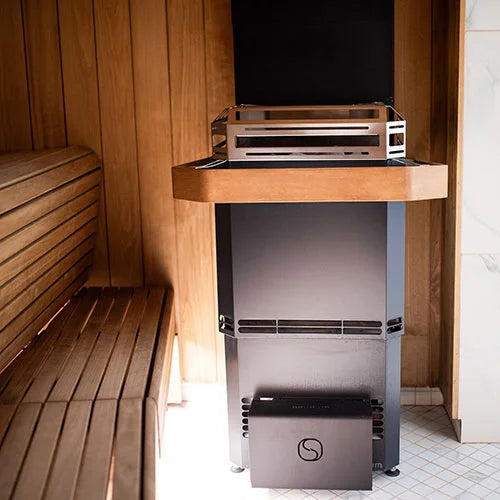 Saunum heater in a sauna with wood